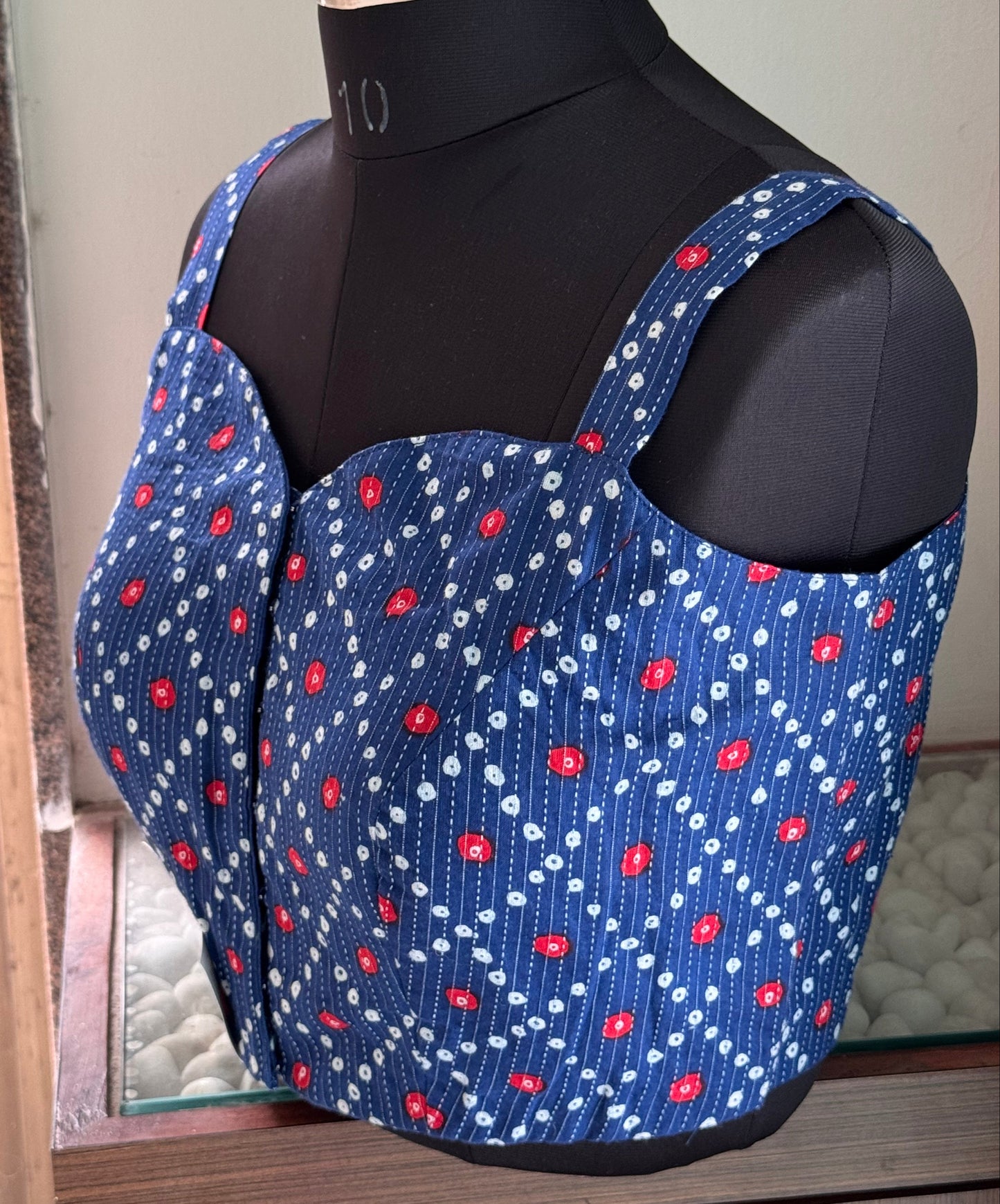 blue sleeveless blouse
