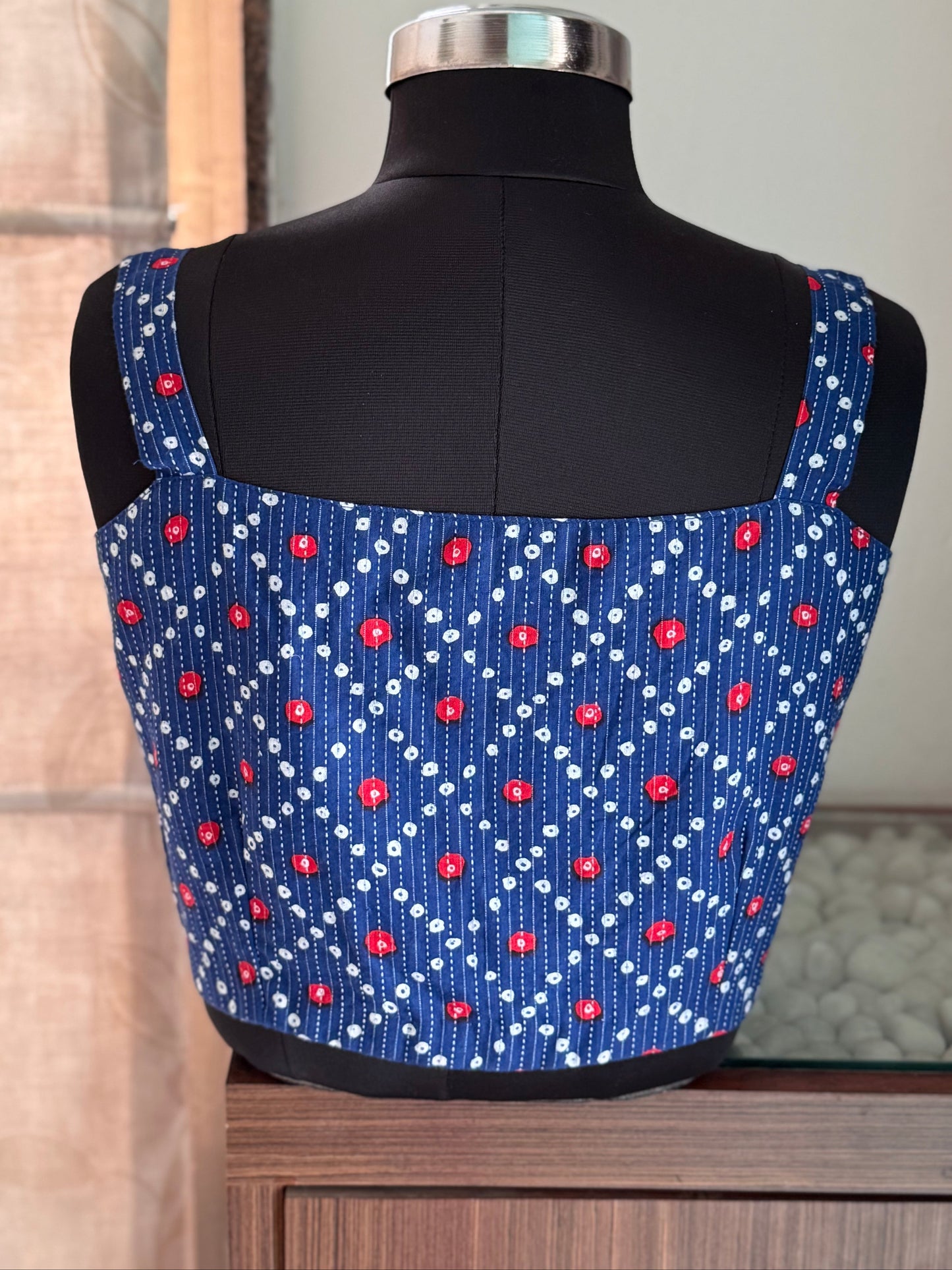 blue sleeveless blouse