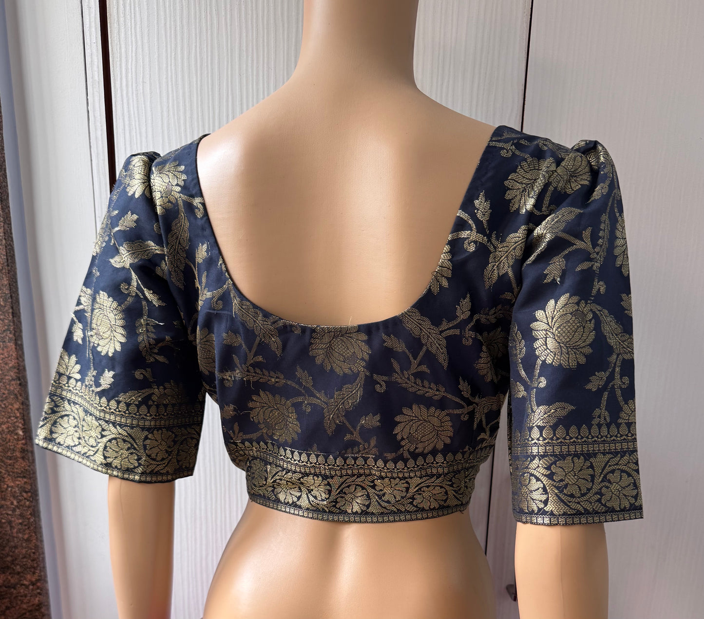 Navy blue blouse with gold floral patterns