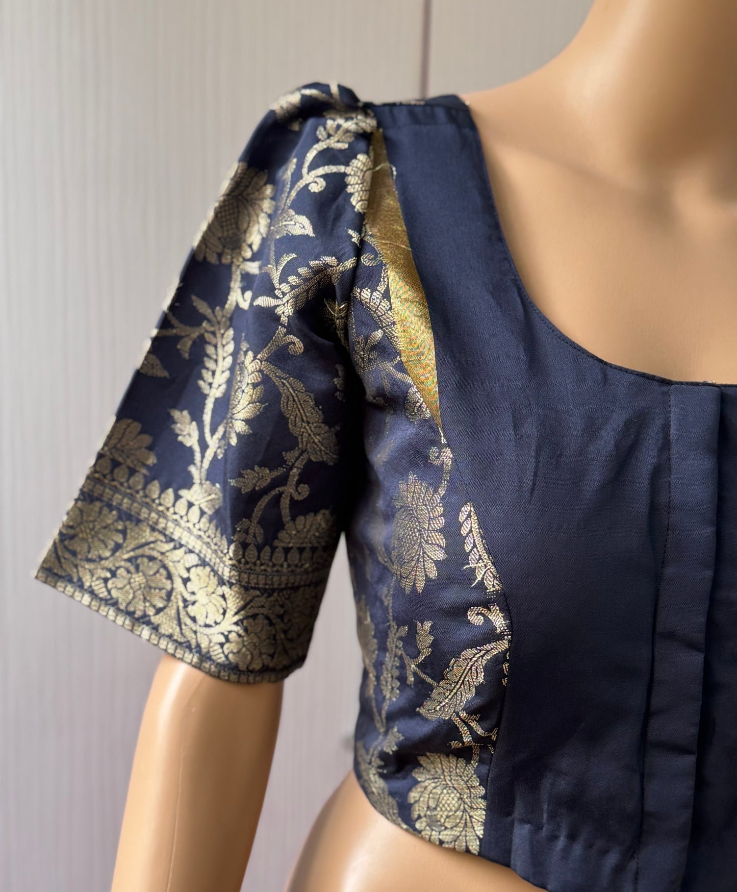 Navy blue blouse with gold floral patterns