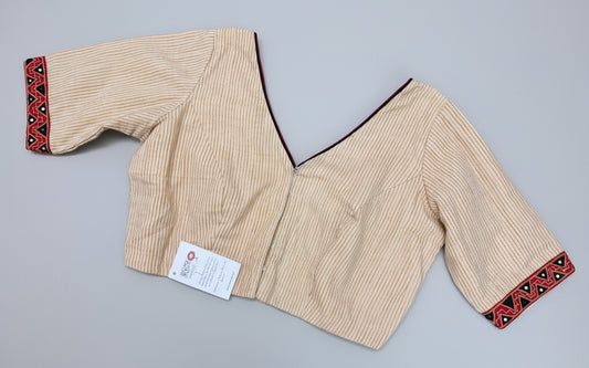 Beige blouse with red and black embroidery 