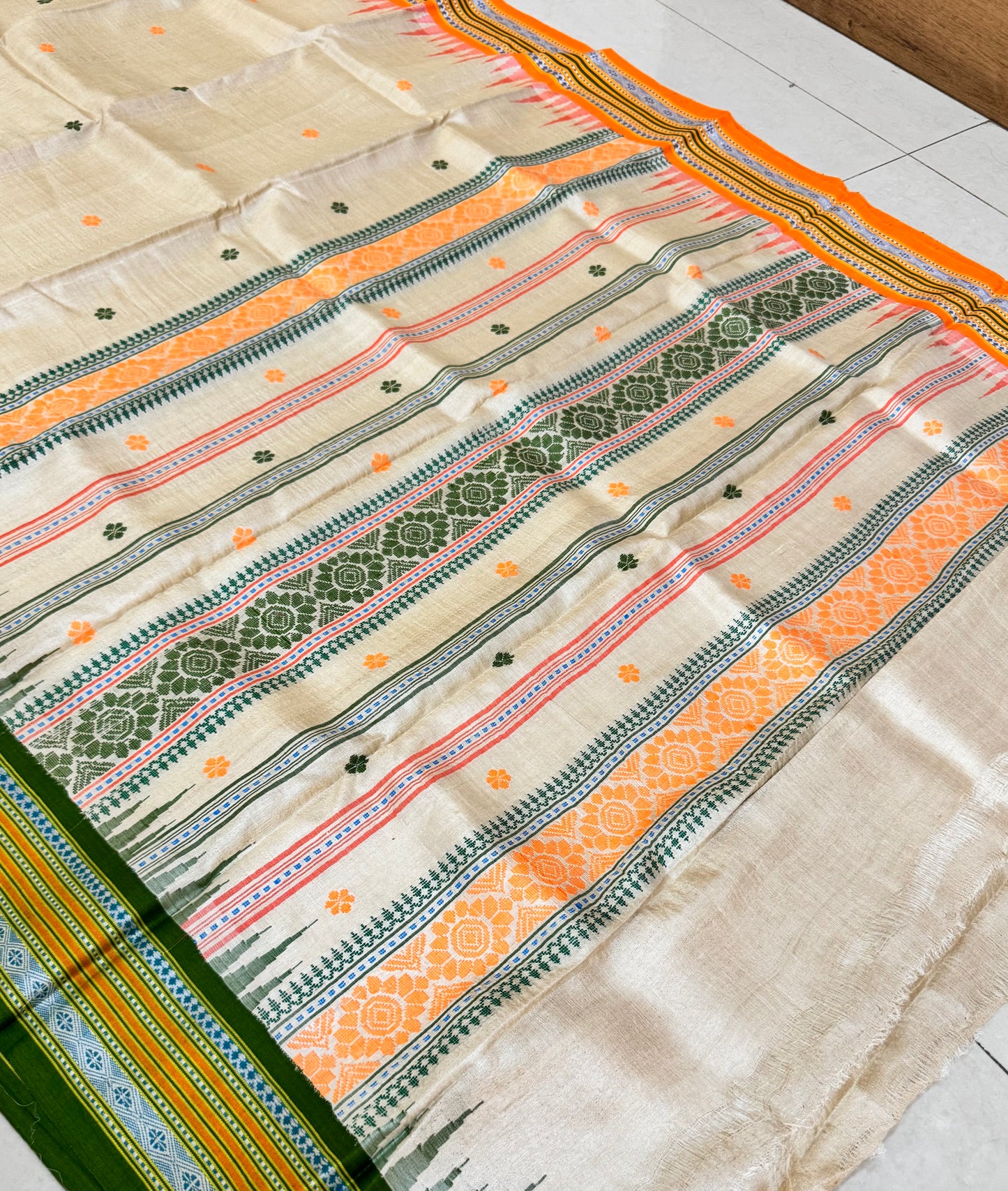 TANAYA : KARVATI KINAAR TUSSAR SILK JHALA PALLA WITH LIGHT-ORANGE AND GREEN  BORDERS