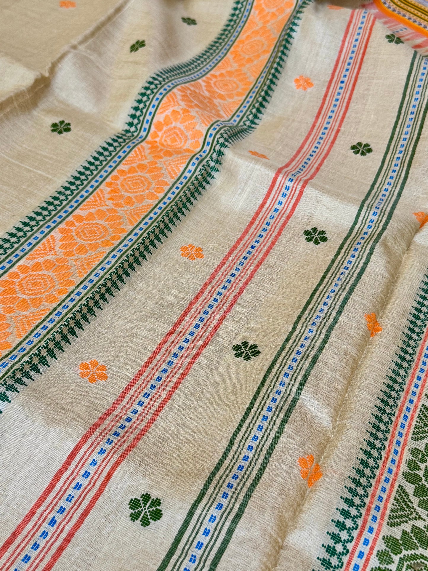 TANAYA : KARVATI KINAAR TUSSAR SILK JHALA PALLA WITH LIGHT-ORANGE AND GREEN  BORDERS