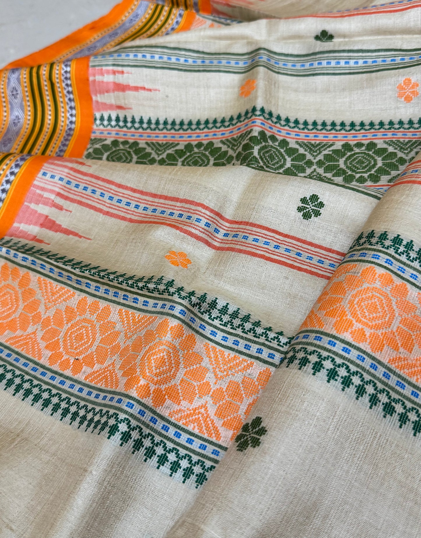TANAYA : KARVATI KINAAR TUSSAR SILK JHALA PALLA WITH LIGHT-ORANGE AND GREEN  BORDERS