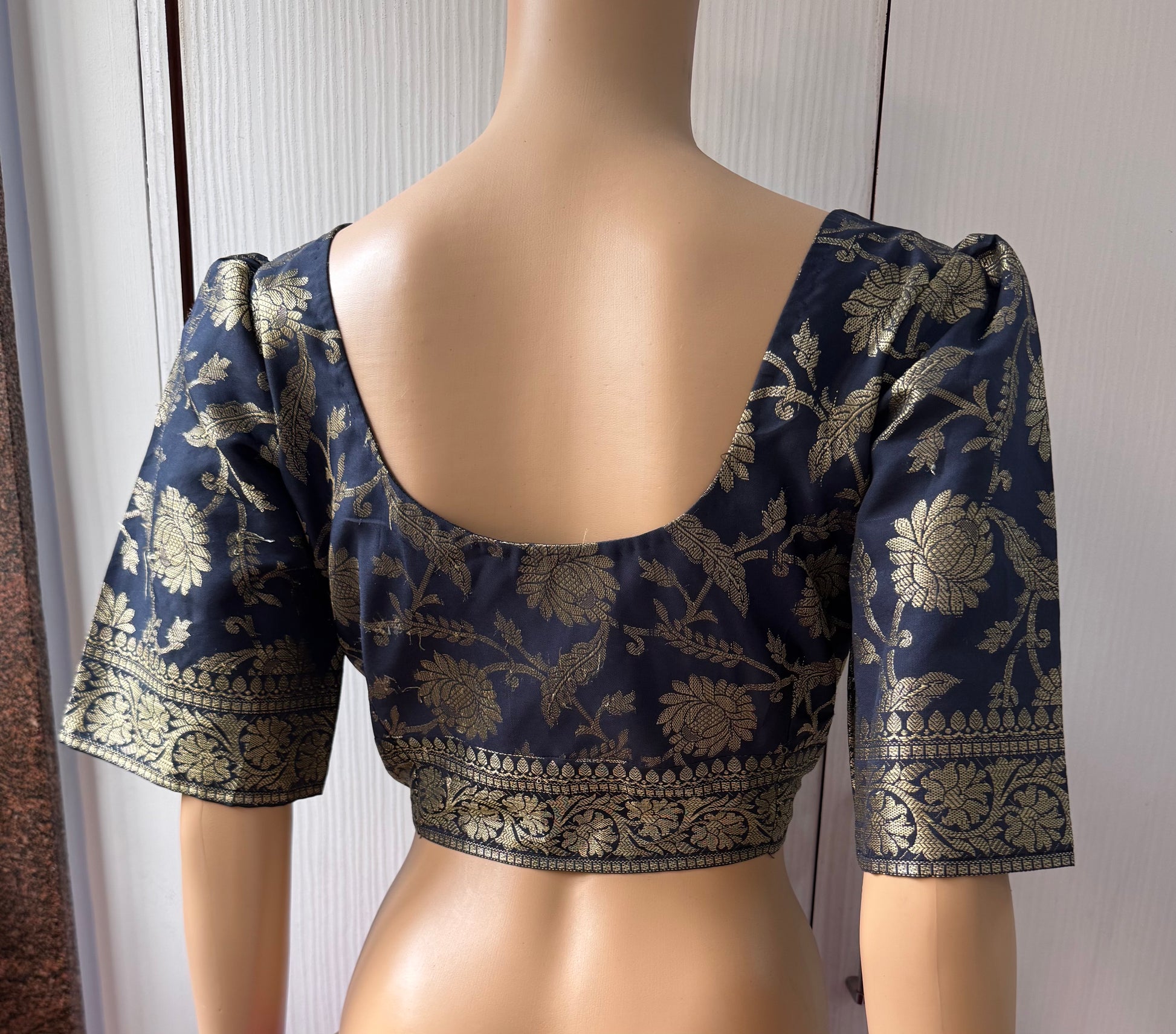 Navy blue blouse with gold floral patterns 